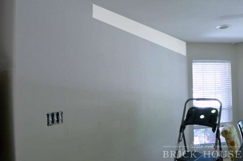 dining room wall with a shiplap board placement at the ceiling