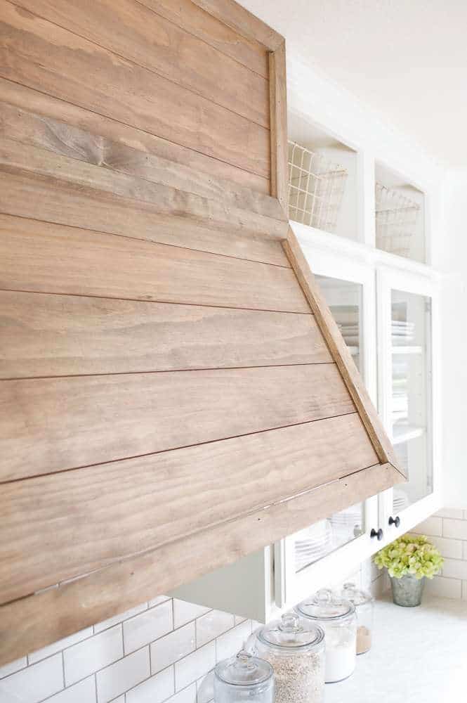 farmhouse style kitchen closeup of wood vent hood