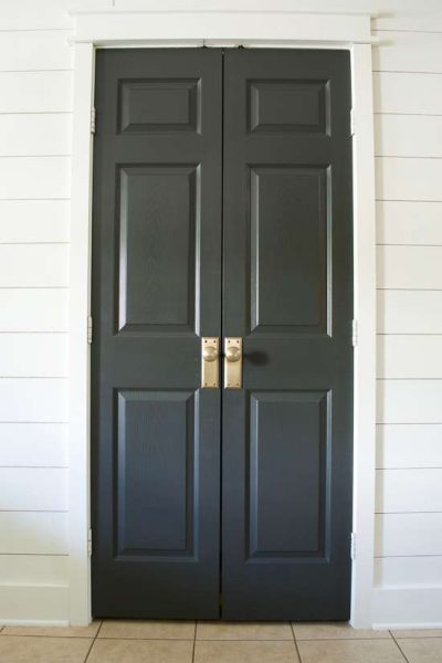 black pantry doors / Sherwin-Williams Iron Ore painted door