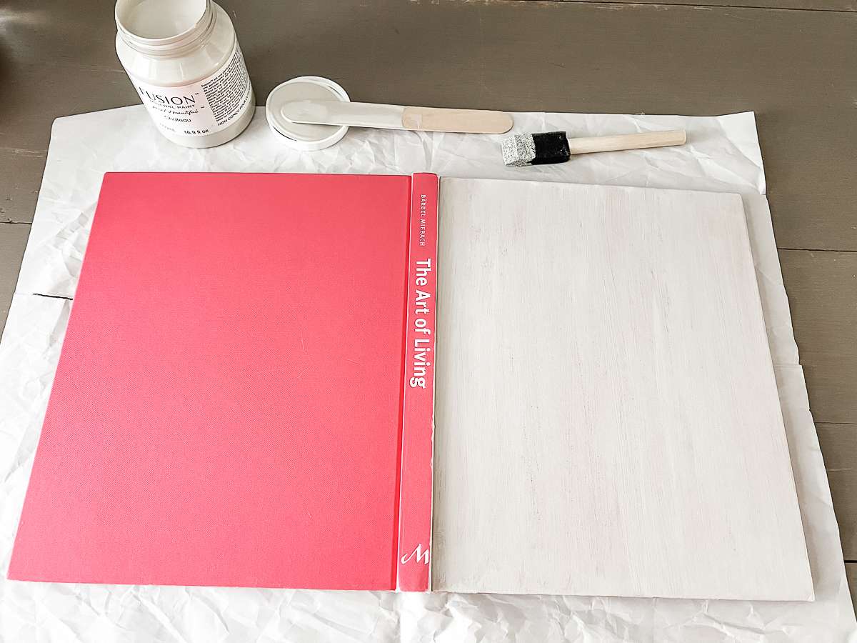 pink book cover being painted light gray